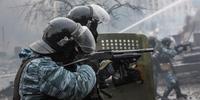 There is growing evidence from across Ukraine of vigilante groups colluding with the police (pictured firing rubber bullets).(C)Brendan Hoffman/Getty Images