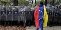 A police officer, a student and a third man died yesterday in separate incidents in Venezuela.(C)LEO RAMIREZ/AFP/Getty Images