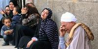 Egyptian relatives of those sentenced to death react to the news outside the Minya Criminal Court. © AFP/Getty Images