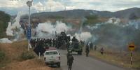 Police used tear gas against protesters during the clashes in 2009 that left 33 dead.(C)Thomas Quirynen