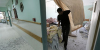 A Palestinian employee inspects damages at the Al-Aqsa Martyrs hospital in Deir al-Balah, in the central Gaza Strip, after the building was shelled by the IDF © AFP/Getty Images