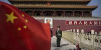 A Chinese soldier stands guard in front of Tiananmen Gate outside the Forbidden City on October 27, 2014 in Beijing, China(C)Kevin Frayer/Getty Images