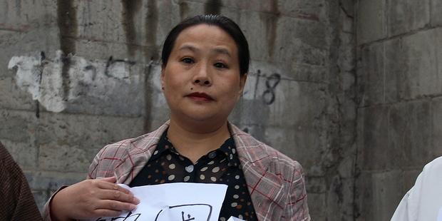 Mao Hengfeng protests for housing rights in Beijing, China, September 2009(C)AI