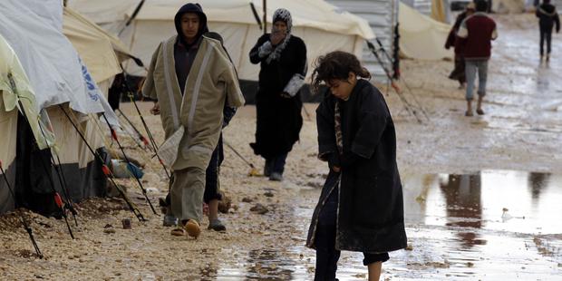 洪水により、苦境にさらされているヨルダン難民キャンプの人びと。(C) AFP/Getty Images 