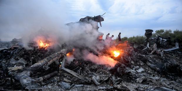 Nearly 300 people died after a civilian passenger jet came down yesterday in an area of intense conflict in eastern Ukraine.(C) EPA/ALYONA ZYKINA EPA/ALYONA ZYKINA.