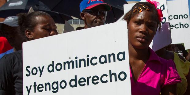 Tens of thousands of individuals born in the Dominican Republic, the vast majority of Haitian descent, are being put at risk of expulsion.(C) ERIKA SANTELICES/AFP/Getty Images