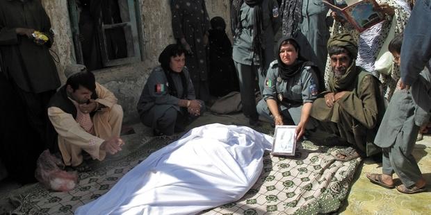 Lieutenant Negar, 38, died on Monday morning in hospital after two unidentified gunmen on a motorbike shot her in the neck on Sunday near police headquarters in Lashkar Gah.(C)AFP/Getty Images 