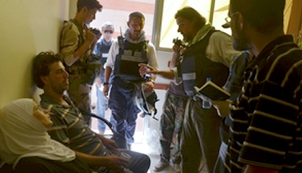 UN chemical weapons experts visit one of the sites of an alleged chemical weapons attack in Zamalka, outside Damascus. © REUTERS/Bassam Khabieh